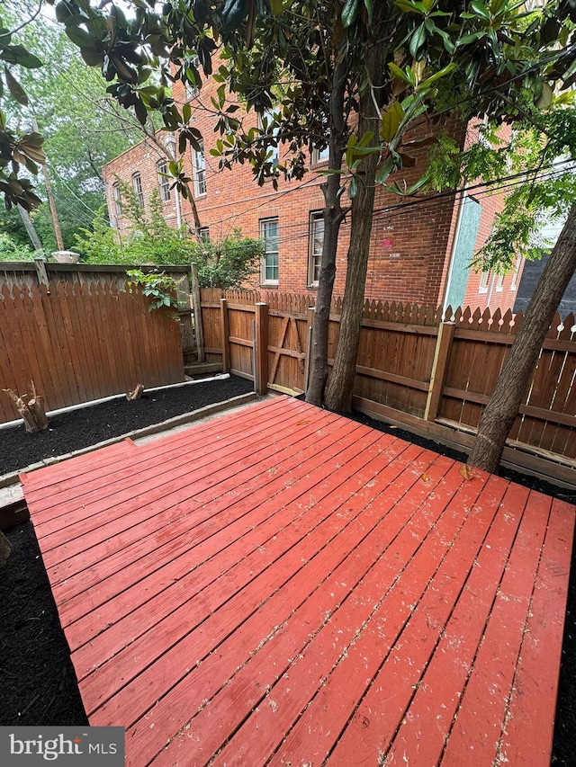 1402 W Lombard St, Baltimore, MD 21223 - wooden terrace featuring a fenced backyard
