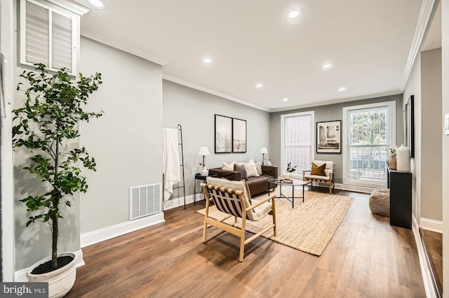 1402 W Lombard St, Baltimore, MD 21223 - living room with crown molding, baseboards, wood finished floors, and recessed lighting