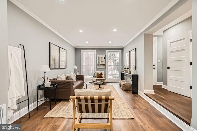 1402 W Lombard St, Baltimore, MD 21223 - living area featuring recessed lighting, baseboards, wood finished floors, and ornamental molding