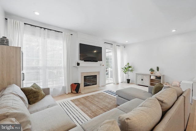 47686 Sandbank Sq, Sterling, VA 20165 - living room featuring a fireplace, recessed lighting, and baseboards