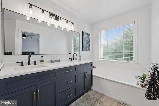 47686 Sandbank Sq, Sterling, VA 20165 - full bath with double vanity, ceiling fan, a bath, and wood finished floors