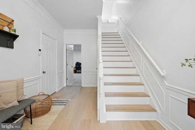 47686 Sandbank Sq, Sterling, VA 20165 - stairway with a decorative wall, wood finished floors, ornamental molding, and wainscoting