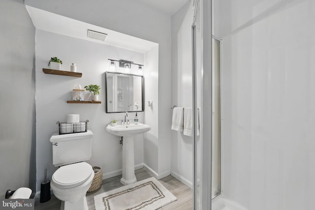47686 Sandbank Sq, Sterling, VA 20165 - full bath with wood finished floors, toilet, a stall shower, and baseboards