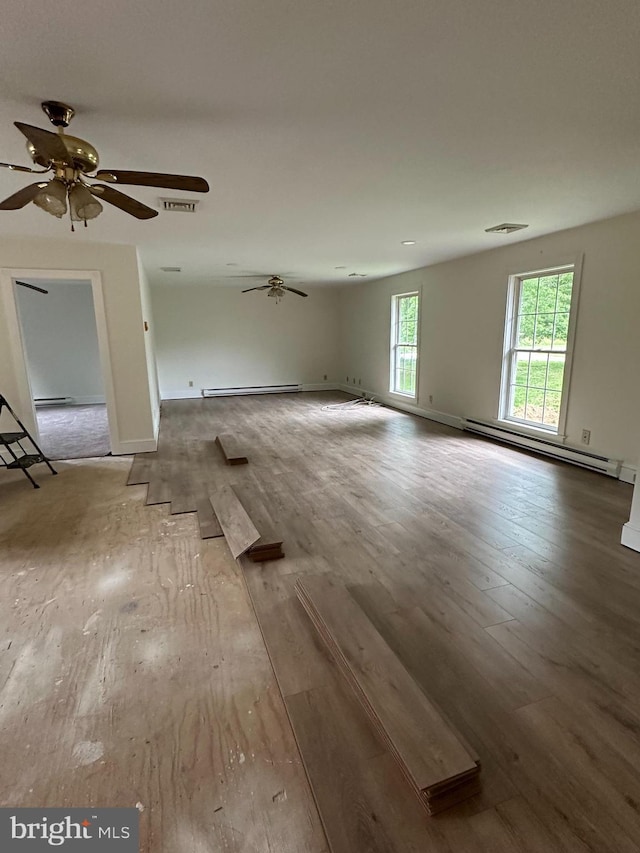 11 Pony Rd, Bridgeton, NJ 08302 - unfurnished living room featuring a baseboard radiator, wood finished floors, and ceiling fan