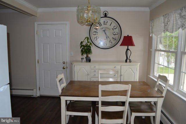 116 Queen Lily Rd, Levittown, PA 19057 - dining room featuring a baseboard radiator, a chandelier, dark wood finished floors, healthy amount of natural light, and crown molding
