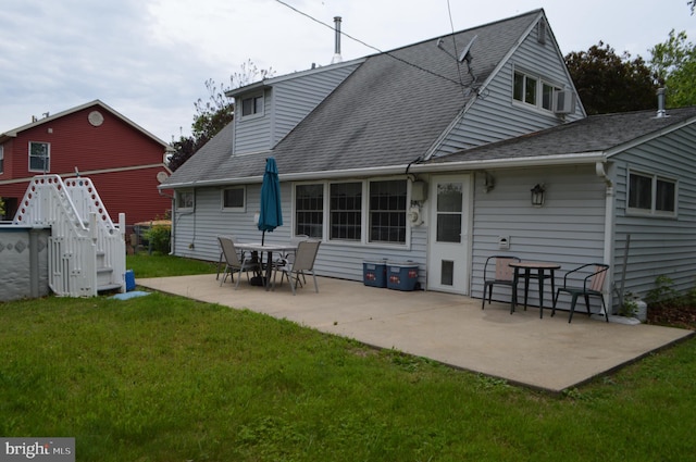 116 Queen Lily Rd, Levittown, PA 19057 - rear view of property featuring a yard, a patio area, and roof with shingles