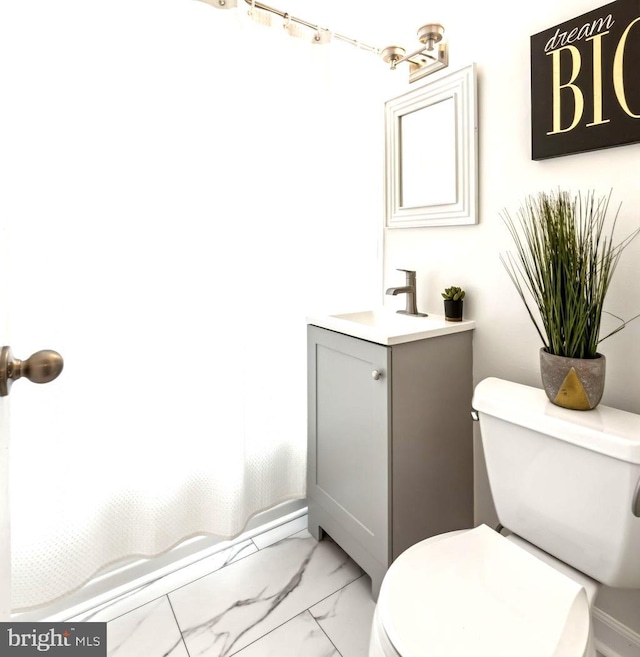 304 Duncan Ave Unit F, Alexandria, VA 22301 - full bathroom featuring vanity, marble finish flooring, and shower / bath combo with shower curtain