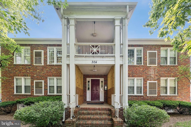 304 Duncan Ave Unit F, Alexandria, VA 22301 - entrance to property with a balcony and brick siding