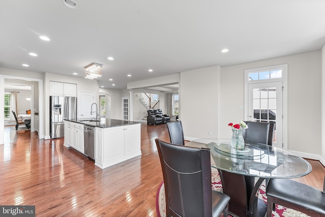 131 Pierce Ln, Kennett Square, PA 19348 - dining room featuring stairs, light wood-style floors, recessed lighting, and baseboards