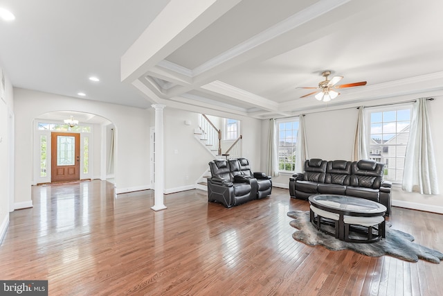 131 Pierce Ln, Kennett Square, PA 19348 - living room featuring hardwood / wood-style floors, stairway, arched walkways, crown molding, and recessed lighting