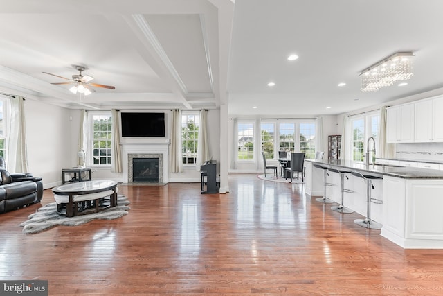 131 Pierce Ln, Kennett Square, PA 19348 - living area with healthy amount of natural light, recessed lighting, a ceiling fan, a high end fireplace, and crown molding