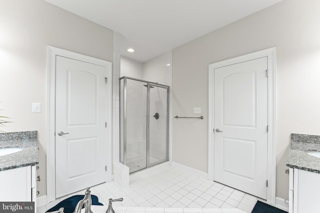 131 Pierce Ln, Kennett Square, PA 19348 - full bathroom with two vanities, a stall shower, tile patterned floors, baseboards, and recessed lighting