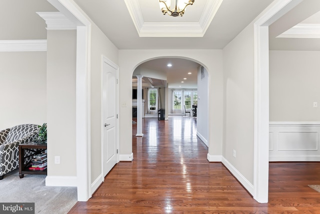 131 Pierce Ln, Kennett Square, PA 19348 - corridor with arched walkways, wood finished floors, decorative columns, ornamental molding, and a chandelier