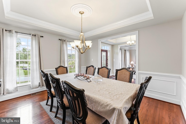131 Pierce Ln, Kennett Square, PA 19348 - dining area featuring a raised ceiling, a chandelier, healthy amount of natural light, ornamental molding, and wainscoting