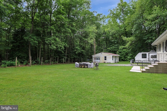 4233 Spire Ct, Snow Hill, MD 21863 - view of green lawn featuring an outbuilding and a detached garage