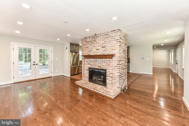 8358 Alvord St, Mclean, VA 22102 - unfurnished living room with french doors, dark wood-style floors, baseboards, a brick fireplace, and recessed lighting