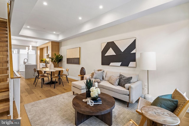 518 S 21st St, Philadelphia, PA 19146 - living area featuring light wood-style flooring, stairs, recessed lighting, baseboards, and a chandelier