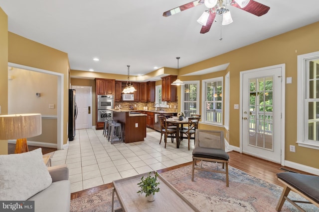 2121 Chaucer Way, Woodstock, MD 21163 - living area featuring baseboards, a ceiling fan, recessed lighting, and light tile patterned floors