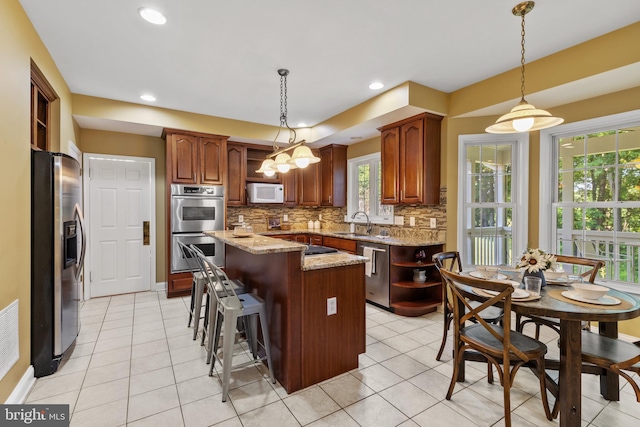 2121 Chaucer Way, Woodstock, MD 21163 - kitchen with stainless steel appliances, open shelves, a center island, tasteful backsplash, and a sink