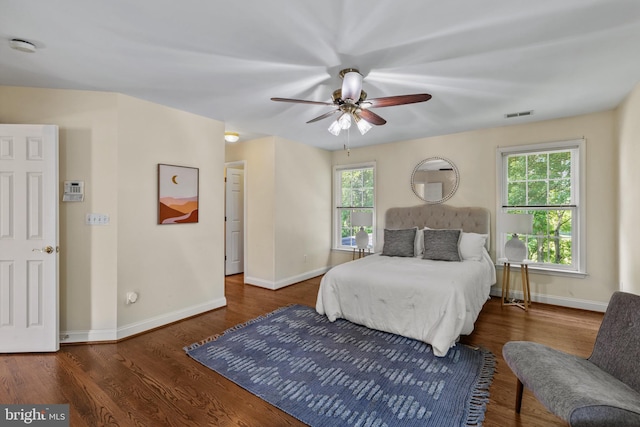 2121 Chaucer Way, Woodstock, MD 21163 - bedroom with baseboards, multiple windows, and wood finished floors