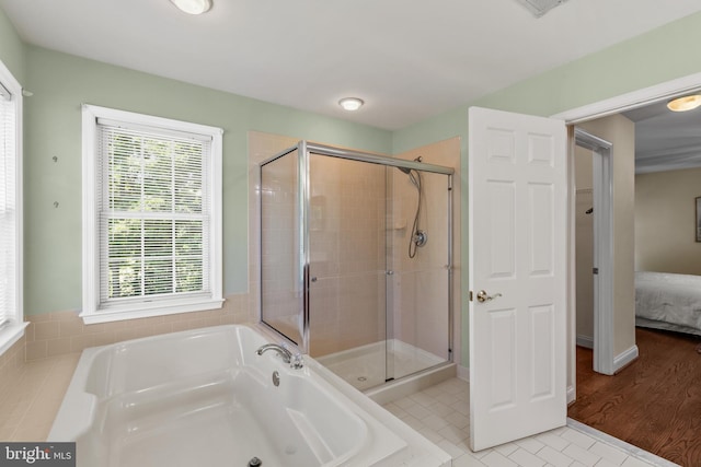 2121 Chaucer Way, Woodstock, MD 21163 - ensuite bathroom featuring a bath, a shower stall, and tile patterned floors