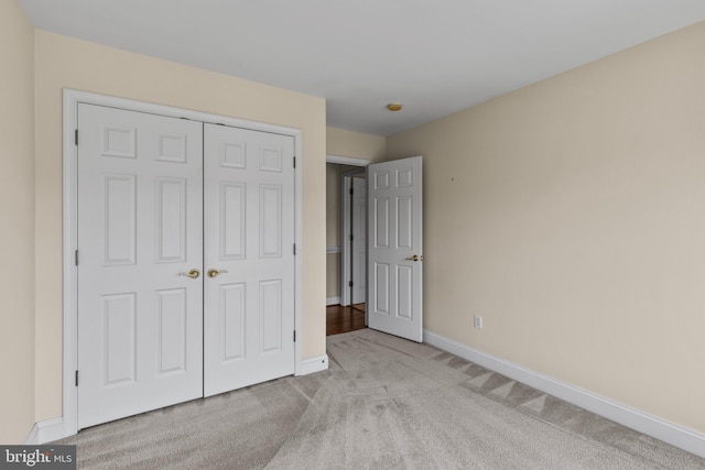 2121 Chaucer Way, Woodstock, MD 21163 - unfurnished bedroom featuring light carpet, baseboards, and a closet