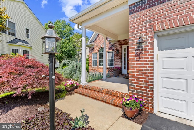2121 Chaucer Way, Woodstock, MD 21163 - property entrance with brick siding and a garage
