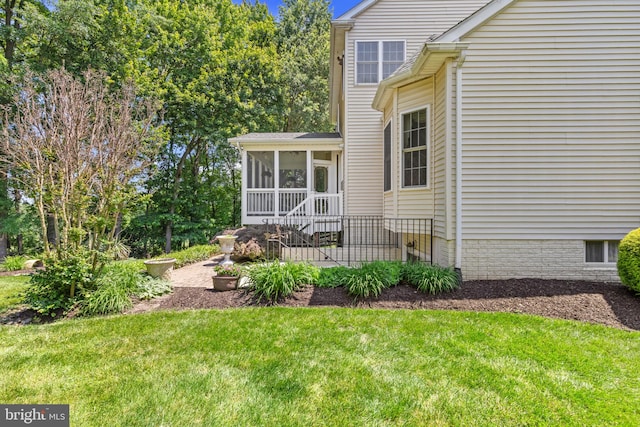 2121 Chaucer Way, Woodstock, MD 21163 - view of side of property with a lawn and a sunroom
