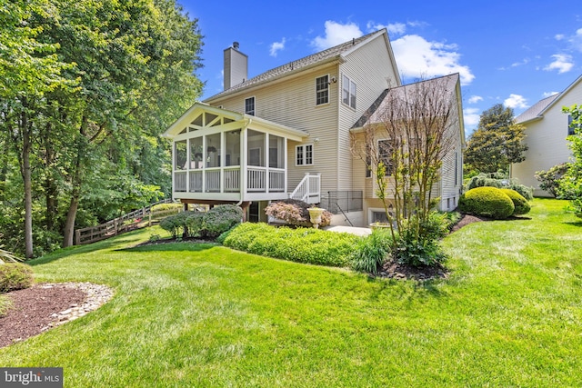 2121 Chaucer Way, Woodstock, MD 21163 - rear view of house featuring a sunroom and a chimney