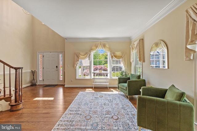 2121 Chaucer Way, Woodstock, MD 21163 - entryway with stairway, plenty of natural light, wood finished floors, crown molding, and baseboards