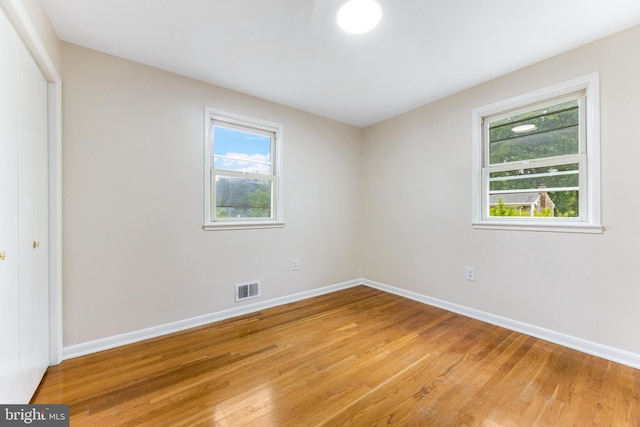 5200 Shires Ct, Clinton, MD 20735 - unfurnished bedroom featuring light wood finished floors, baseboards, and a closet