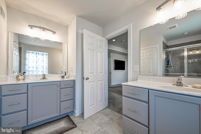 311 Ironstone Ln, Elverson, PA 19520 - bathroom with two vanities, a stall shower, tile patterned floors, and baseboards