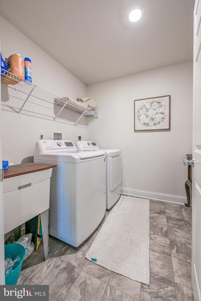 311 Ironstone Ln, Elverson, PA 19520 - washroom featuring washer and dryer and baseboards