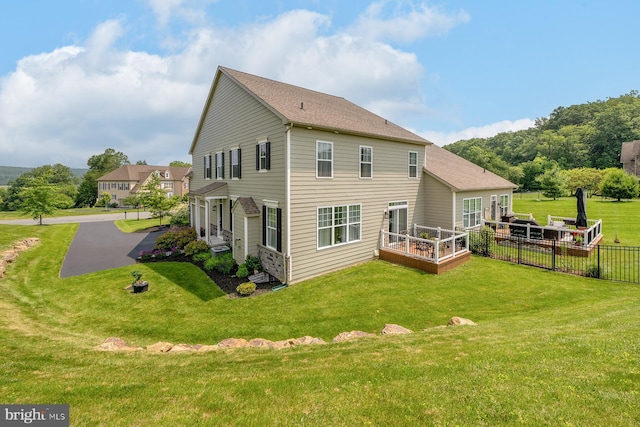 311 Ironstone Ln, Elverson, PA 19520 - back of property with a lawn and a wooden deck