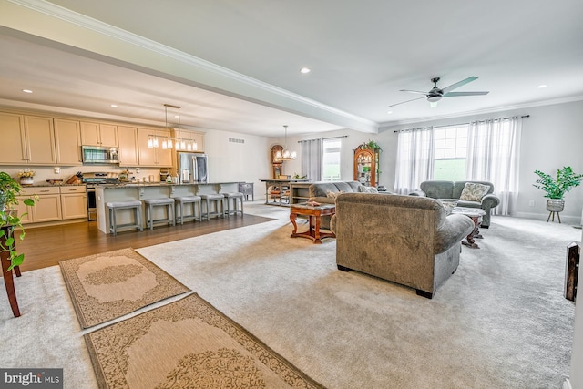 311 Ironstone Ln, Elverson, PA 19520 - living room with a ceiling fan, recessed lighting, ornamental molding, and a chandelier