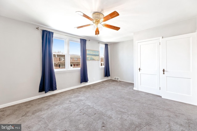 7155 Erdrick St, Philadelphia, PA 19135 - unfurnished bedroom with carpet, baseboards, and ceiling fan