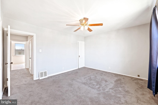 7155 Erdrick St, Philadelphia, PA 19135 - empty room with a ceiling fan, carpet floors, and baseboards