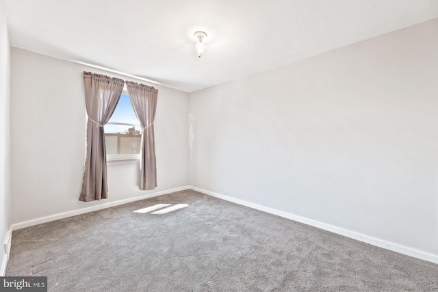 7155 Erdrick St, Philadelphia, PA 19135 - carpeted empty room with baseboards