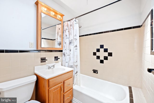 7155 Erdrick St, Philadelphia, PA 19135 - bathroom with toilet, shower / tub combo with curtain, vanity, and tile walls