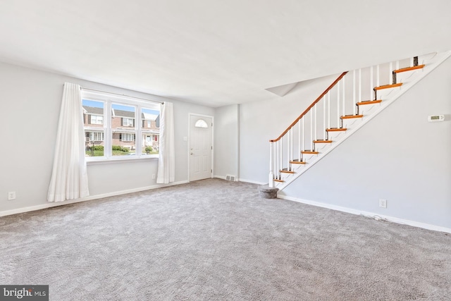 7155 Erdrick St, Philadelphia, PA 19135 - carpeted foyer entrance featuring stairway and baseboards
