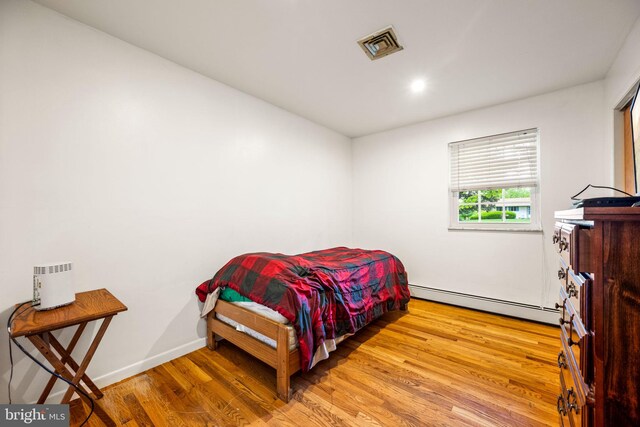 2460 Mill Rd, Quakertown, PA 18951 - bedroom with a baseboard radiator, wood finished floors, and recessed lighting