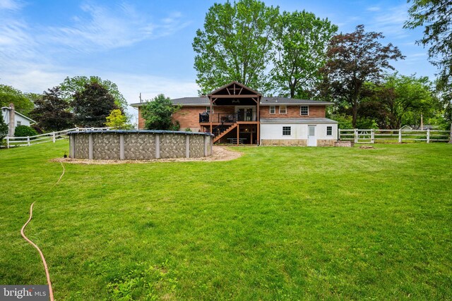 2460 Mill Rd, Quakertown, PA 18951 - back of house with stairway, a deck, an outdoor pool, and brick siding
