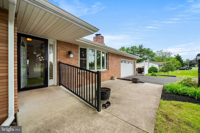 2460 Mill Rd, Quakertown, PA 18951 - view of patio / terrace with concrete driveway and an attached garage