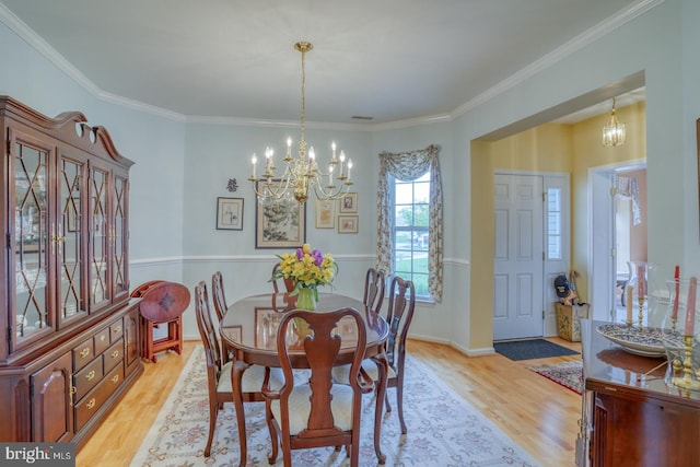 636 Poets Way, Middletown, DE 19709 - dining area featuring a chandelier, light wood-style flooring, ornamental molding, and baseboards
