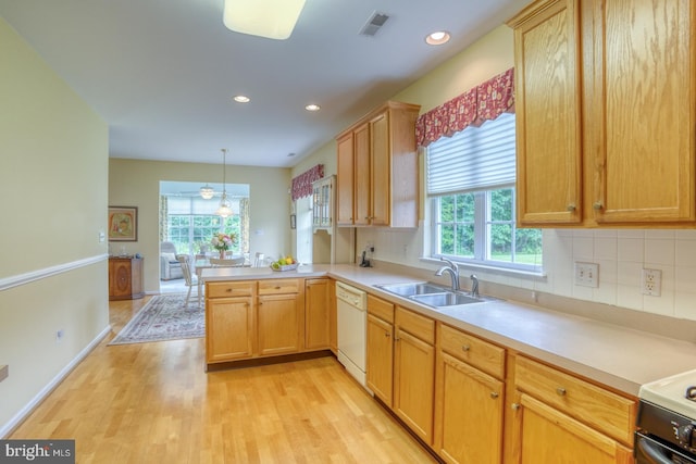 636 Poets Way, Middletown, DE 19709 - kitchen with white dishwasher, light wood-type flooring, a sink, tasteful backsplash, and recessed lighting
