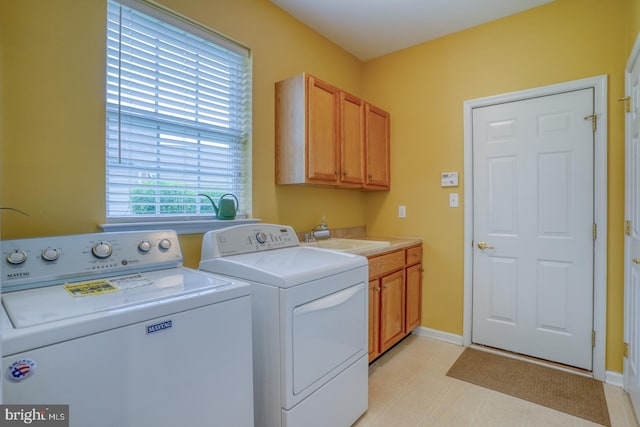 636 Poets Way, Middletown, DE 19709 - laundry area with separate washer and dryer, cabinet space, baseboards, and light floors