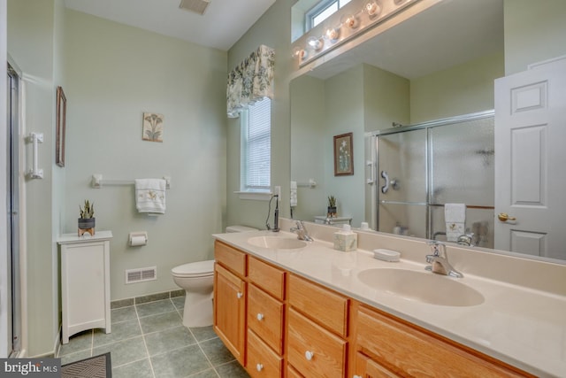 636 Poets Way, Middletown, DE 19709 - bathroom with a shower stall, double vanity, toilet, tile patterned flooring, and baseboards