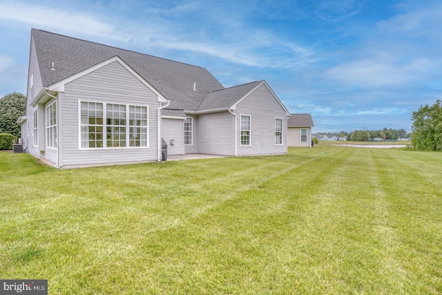 636 Poets Way, Middletown, DE 19709 - back of property with a patio area, a lawn, and a shingled roof