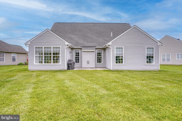 636 Poets Way, Middletown, DE 19709 - back of house featuring a lawn, a patio area, and a shingled roof