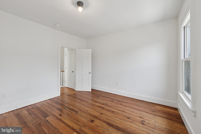 439 Mercy St, Philadelphia, PA 19148 - unfurnished room featuring hardwood / wood-style floors, baseboards, healthy amount of natural light, and a smoke detector